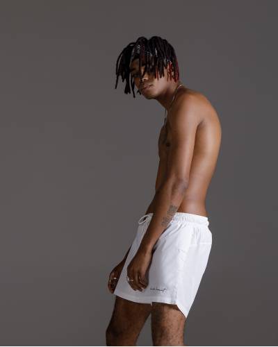 White swimming trunks with script embroidery